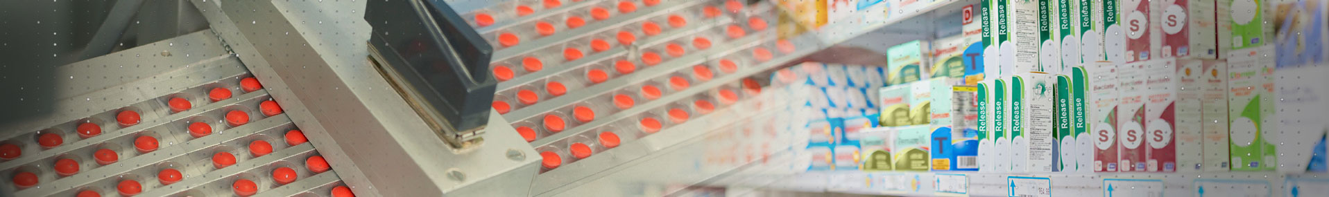 Pharmaceutical pills in production and boxed on shelves