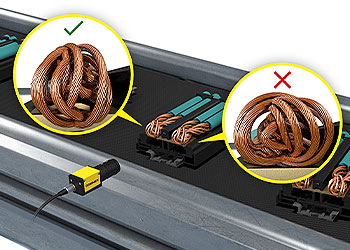 Sistema de visión inspeccionando cable trenzado en un componente eléctrico