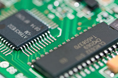 up close circuit board components with codes