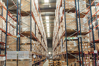 large logistics warehouse with packages stored on shelves